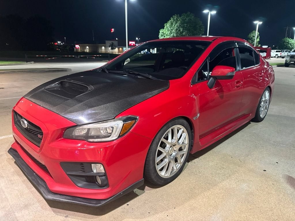 2016 Subaru WRX STI Limited in Red — front three-quarter view